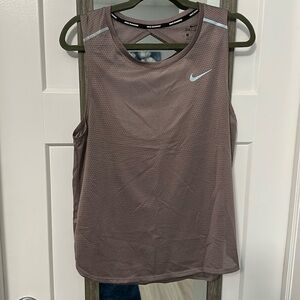 Nike pink/purplish open back jersey like material tank top size large!
